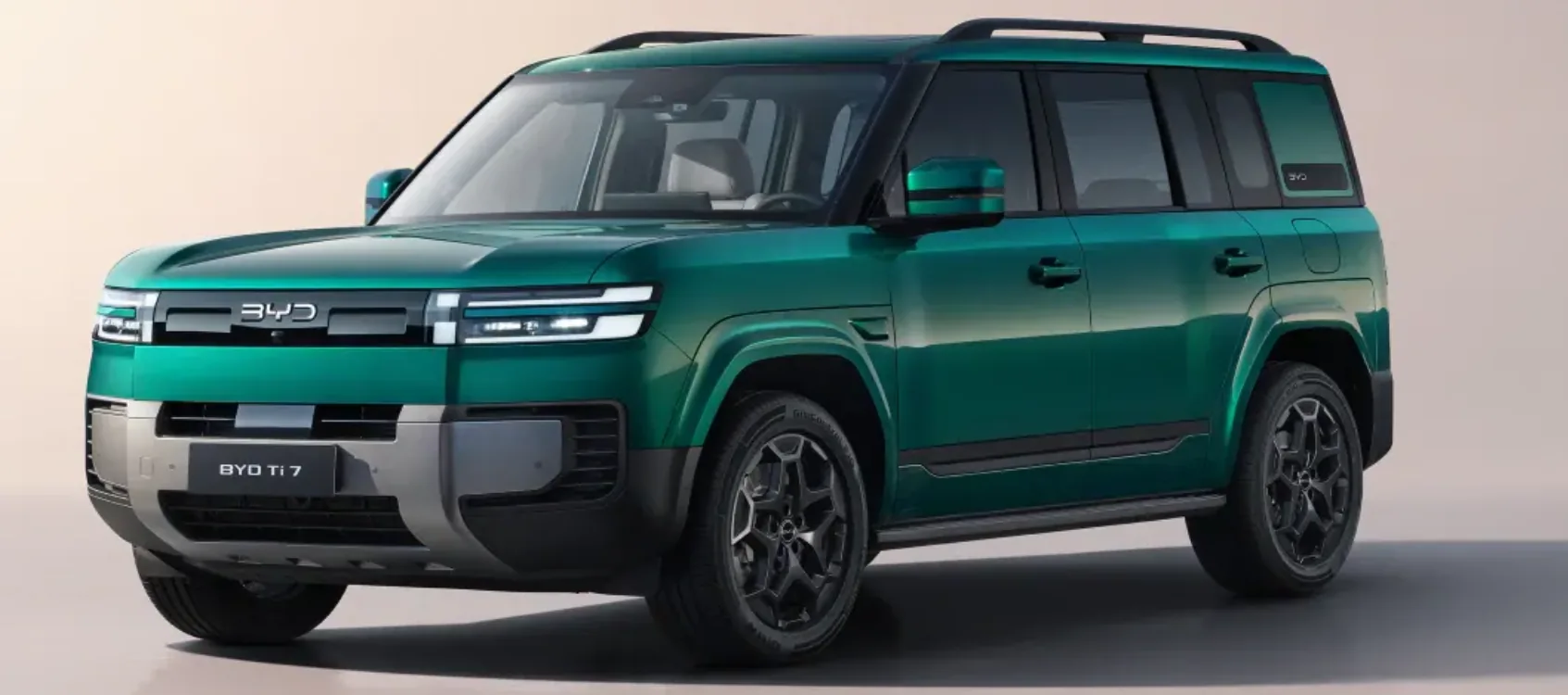 Green BYD Ti 7 SUV, front three-quarter view, official UK promotional image