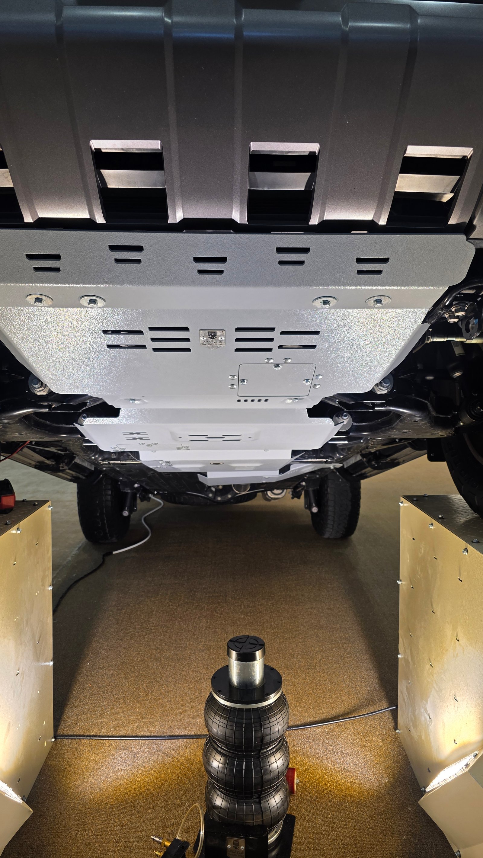 Installed off-road skid plate and underbody protection photographed at SFC 2026